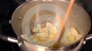 Cook stirring diced onion in a saucepan