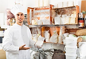 cook taking package with grit in pantry room.