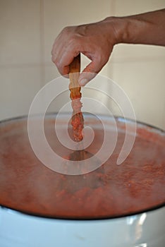 Cook tomato paste for the winter