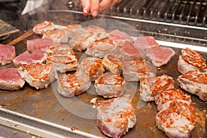 Cook turn around grilled meat