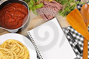 Cookbook with recipe ingredients for Italian spaghetti bolognese, copy space