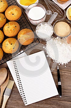 Cookbook for recipe with cake baking ingredients, copy space, vertical