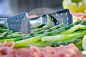 Cooked asparagus beautifully presented on a tray