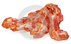 Cooked bacon rashers close-up isolated on a white background. photo