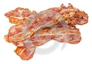 Cooked bacon rashers close-up isolated on a white background.