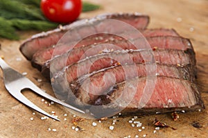 Cooked beef steak sliced medium rare close-up