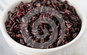 Cooked black rice in bowl