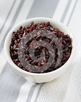 Cooked black rice in bowl