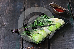 Cooked bok choy with sesame seeds photo