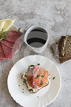 Cooked breakfast with coffee and sandwich.