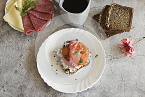 Cooked breakfast with coffee and sandwich.