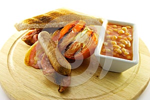 Cooked Breakfast Items on a Wooden Plate