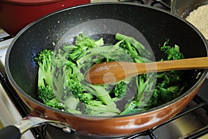 Cooked broccoli ready to be eaten. Few sliced broccoli.