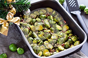 Cooked Brussel Sprouts with Pecan Nuts On a ChristmasTable photo