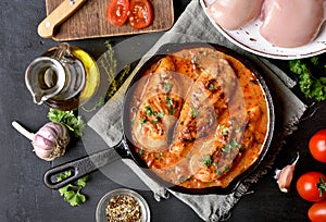 Cooked chicken breast with tomato sauce photo