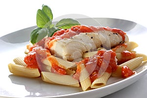 Cooked cod loins with tomato sauce