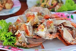 Cooked crabs with green Vegetable on dish