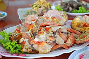 Cooked crabs with green Vegetable on dish