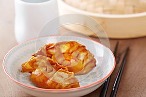 Cooked dim sums with soy sauce