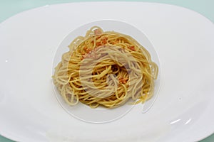 Cooked egg noodles on white plate