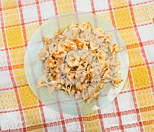 Cooked farfalle pasta served tomato sauce