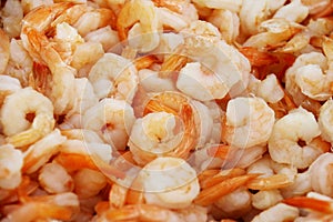 Cooked farmed shrimp on ice at fish market