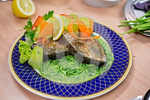 Cooked fish served on plate