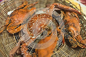 Cooked Flower crabs, locally known as Alimasag, on a rattan platter served for lunch