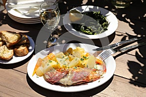 Cooked fresh red scorpionfish sarved with boiled potatoes in the greek tavern.