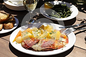 Cooked fresh red scorpionfish sarved with boiled potatoes in the greek tavern.