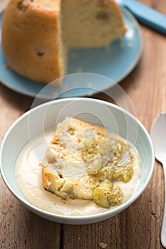 Cooked gooseberry summer pudding with vanilla custard and gooseberry