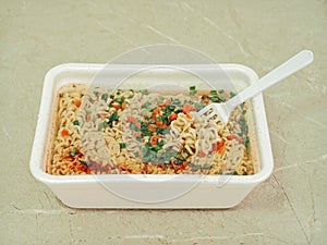 Cooked instant noodles with spices.