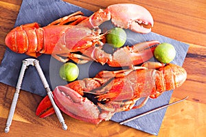 Cooked Lobsters on Table with Lime and Tool