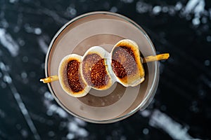 Cooked Marshmallow Cocktail with Pretzel Sticks  also Called Sweet Baby or Babyccino
