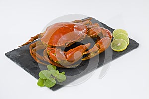 Cooked mud crab on graphite base