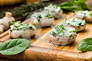 Cooked mushrooms stuffed with spinach and cheese