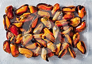 Cooked mussels on an opacity plastic tray