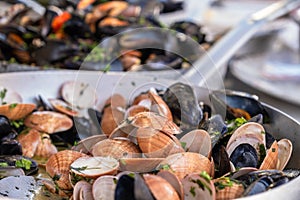 Cooked mussels and seafood in pan, food market Ballaro in Palermo