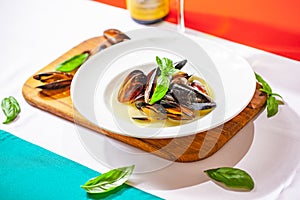 Cooked mussels on white plate