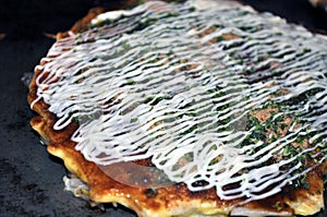 Cooked Okonomiyaki on hotplate