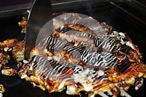 Cooked Okonomiyaki on hotplate