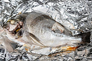 Cooked Orata fish baked in foil