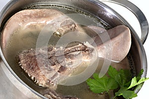 Cooked pork tongue in broth