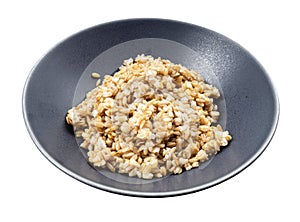 Cooked porridge from whole-grain oat in gray bowl