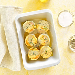 Cooked potatoes in baking dish