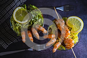 Cooked Prawn cocktail starter served in a tropical tourist restaurant in a glass with decoration of prawn with sprinkle of dill,