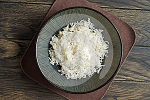 Cooked rice in a bowl on the table above