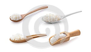 Cooked rice in spoon on white background