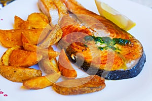 Cooked salmon fish with potatoes