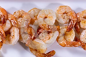 Cooked shrimps on plate. Close up